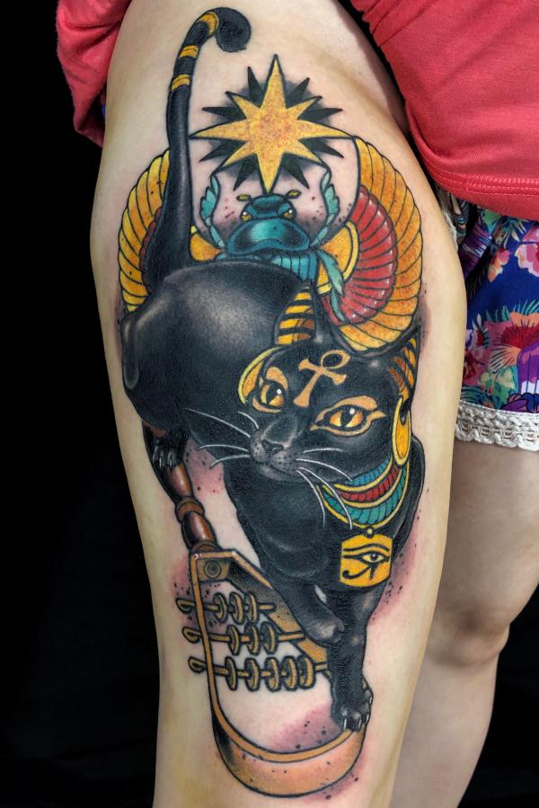 Traditional Bastet holding sistrum with Scarab Beetle tattoo