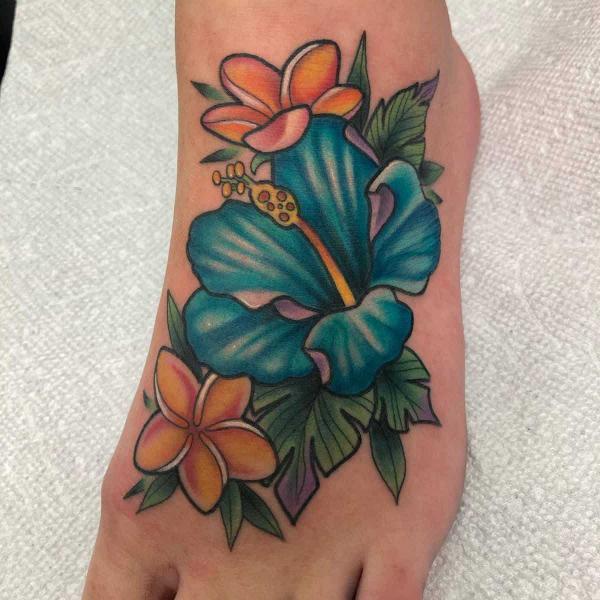 Traditional Hawaiian blue hibiscus and plumeria foot tattoo
