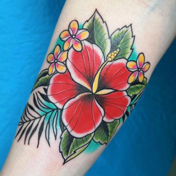 Traditional Hawaiian hibiscus and plumeria tattoo