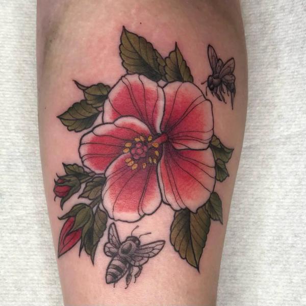 Traditional hibiscus and bee tattoo