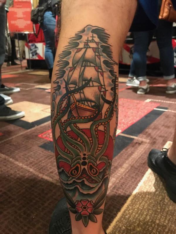 Traditional kraken and ship calf tattoo