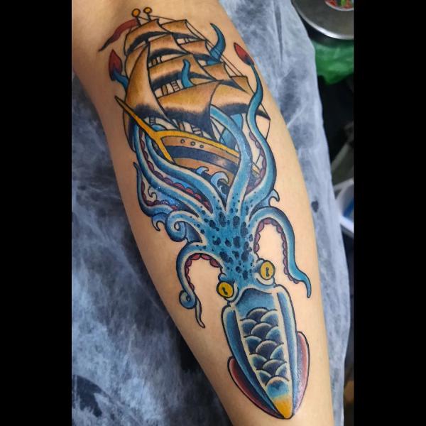Traditional kraken ship calf tattoo