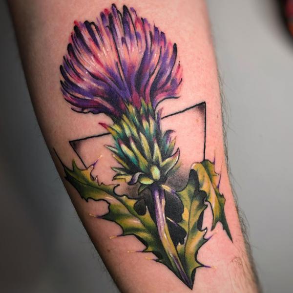 Traditional thistle with triangle tattoo