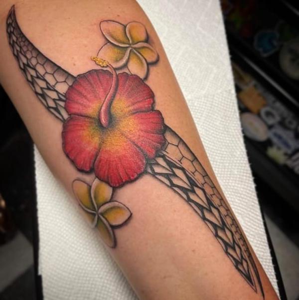 Tribal Hawaiian hibiscus and plumeria tattoo