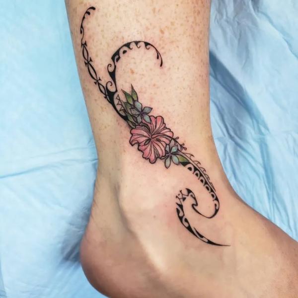 Tribal hibiscus ankle tattoo