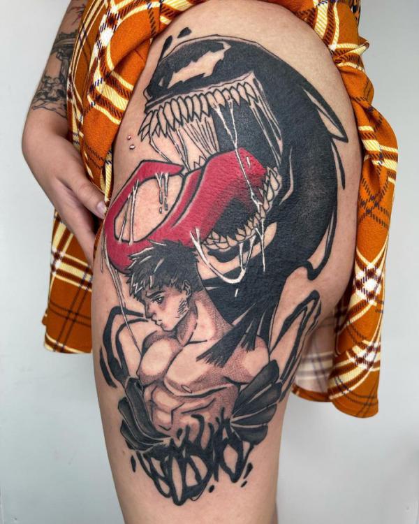 Venom and fighter thigh tattoo