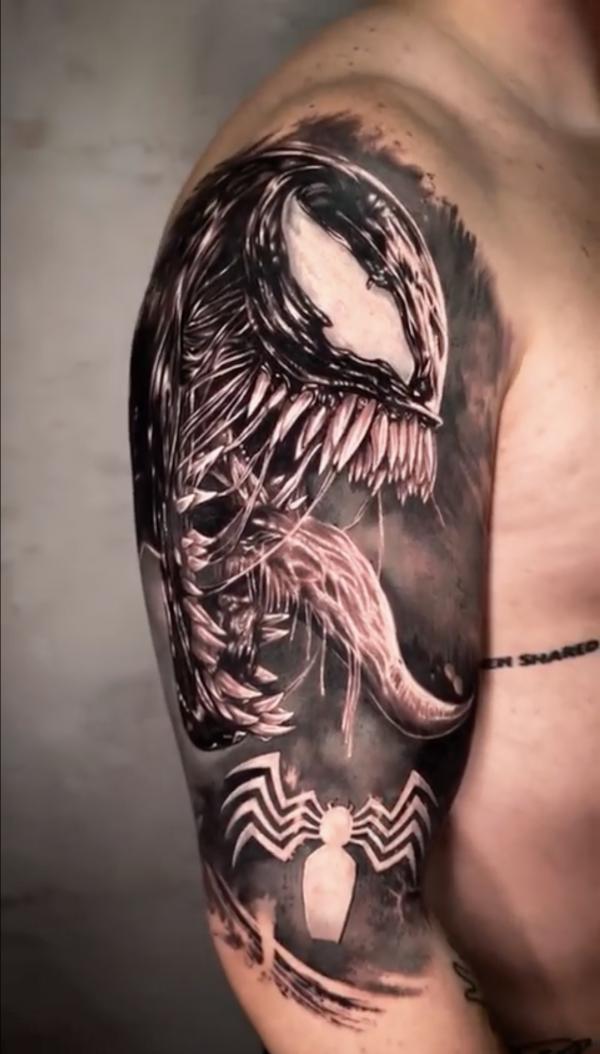Venom and spider logo tattoo