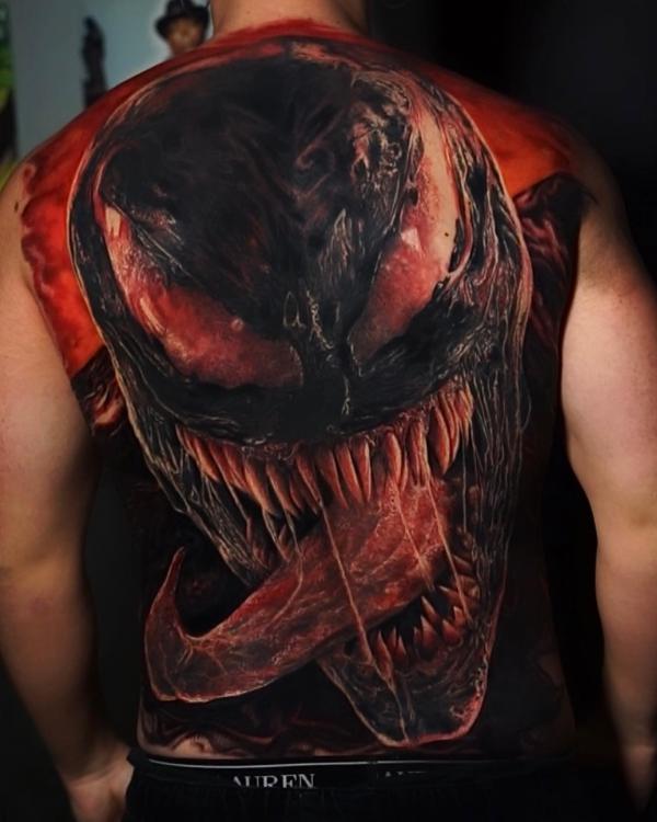Venom face tattoo on full back