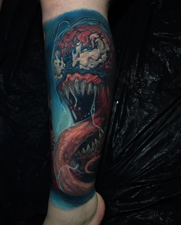 Venom lower leg tattoo