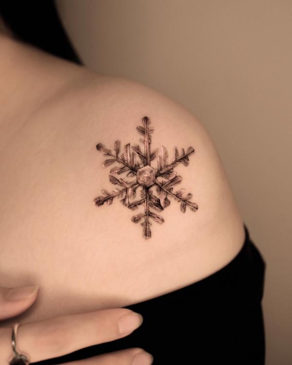Vintage snowflake shoulder tattoo