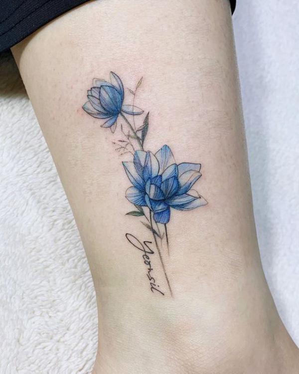 Watercolor blue lotus tattoo with name
