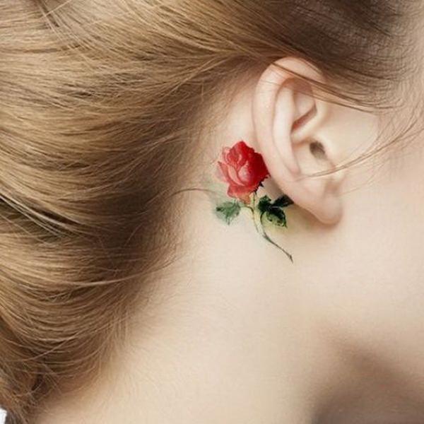 Watercolor floral tattoo behind ear
