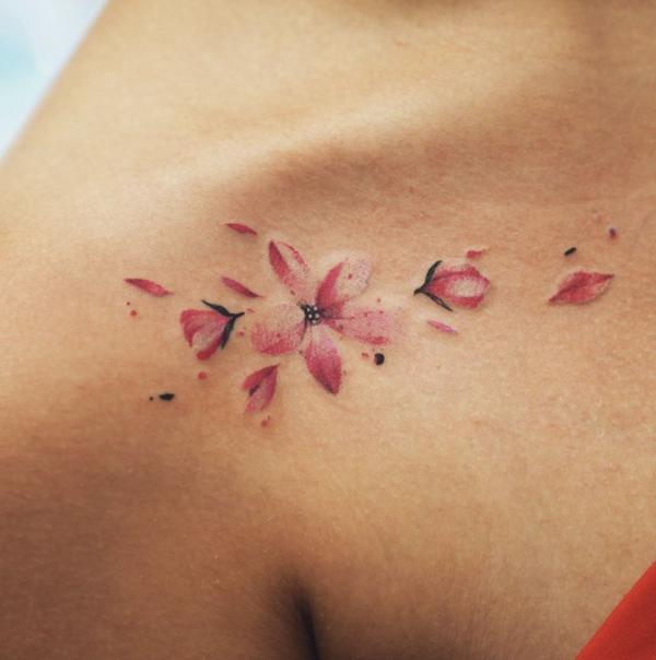 Watercolor flower collarbone tattoo