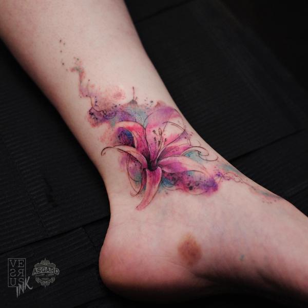 Watercolor lily floral ankle tattoo