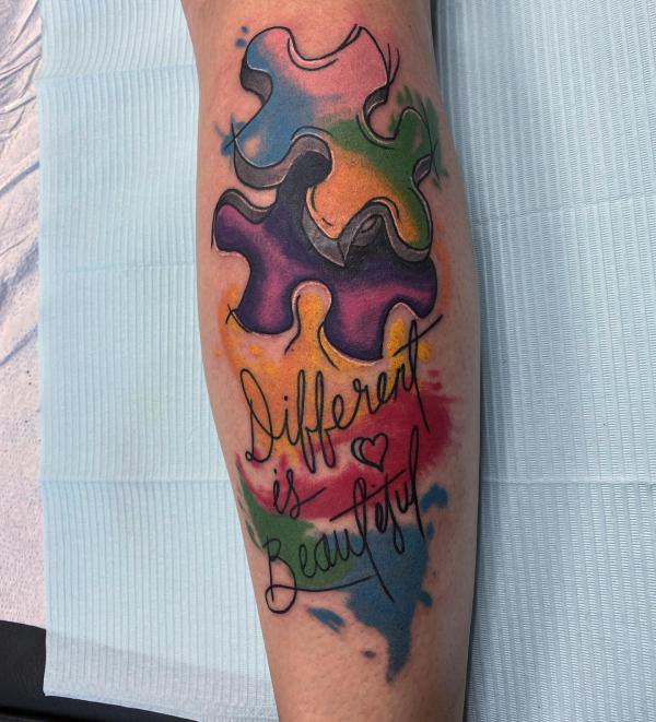 Watercolor puzzle tattoo with words Different is beautiful