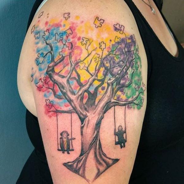 Watercolor puzzle tree tattoo