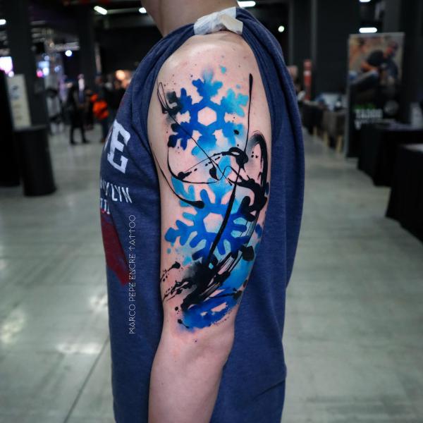 Watercolor snowflake tattoo