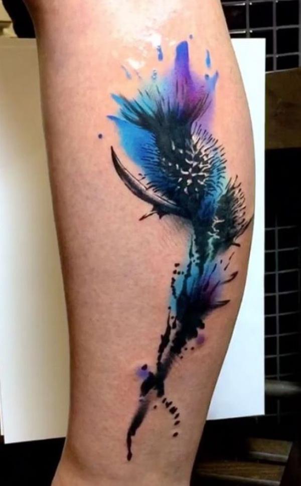 Watercolor thistle low leg tattoo