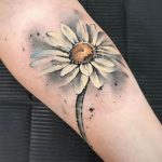 Watercolor white daisy tattoo on arm