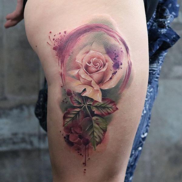 Watercolor white rose tattoo on thigh