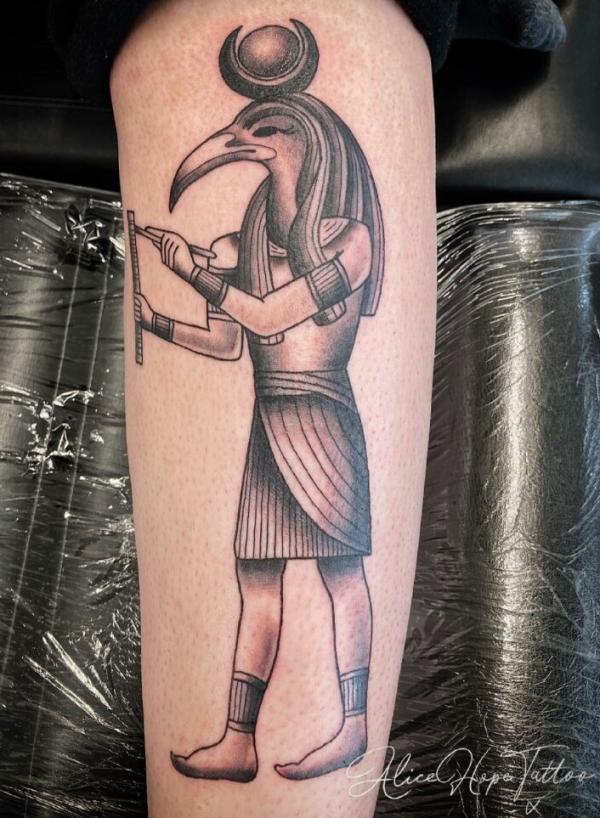 Writing Thoth arm tattoo
