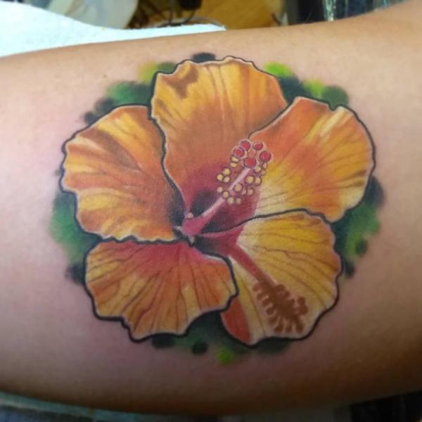 Yellow hibiscus tattoo