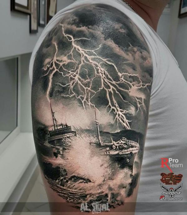 black and grey shipwreck with lightning tattoo