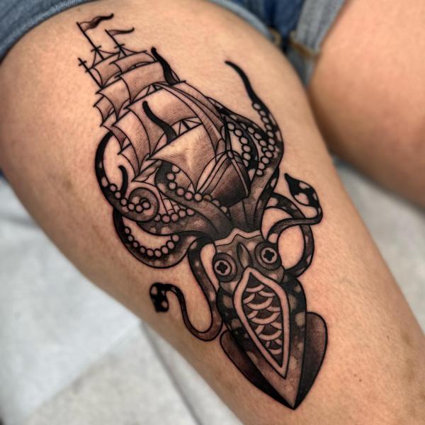 kraken and ship thigh tattoo