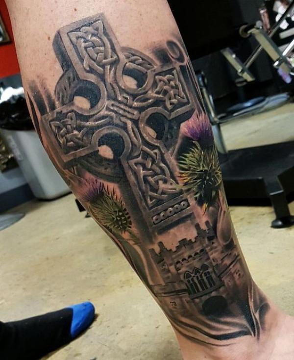 3D Celtic cross with thistle and castle tattoo