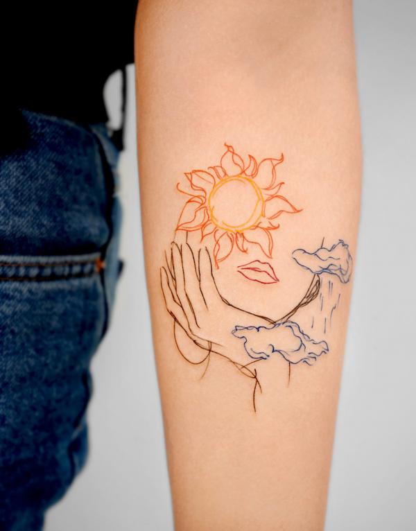 Abstract sun face outline tattoo