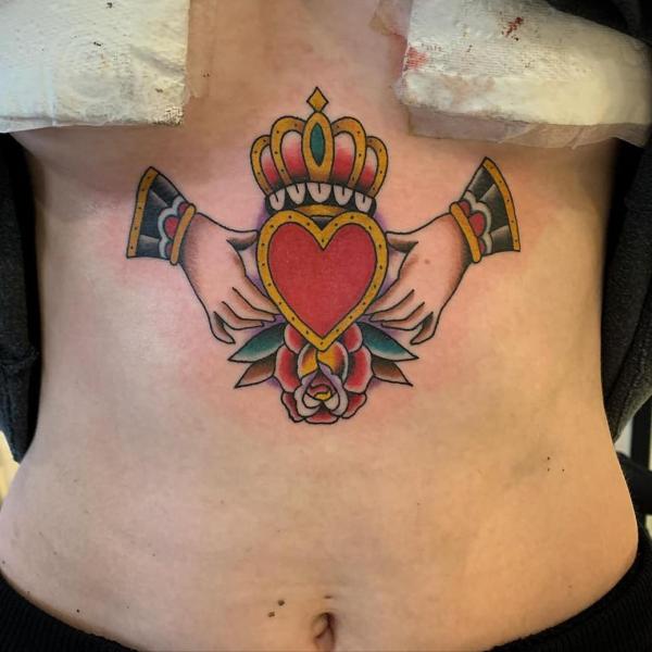 American traditional claddagh sternum tattoo