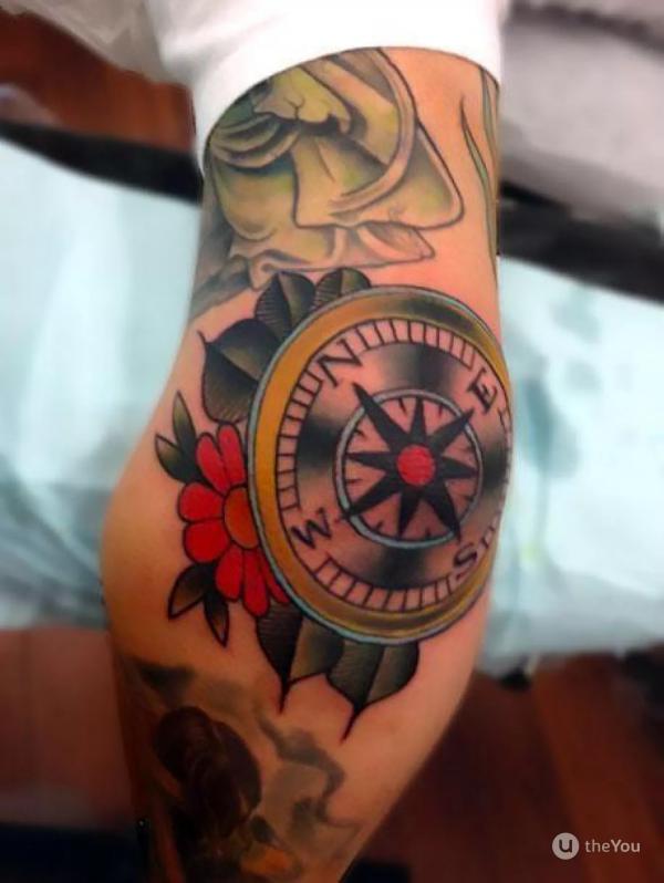 American traditional compass tattoo on elbow