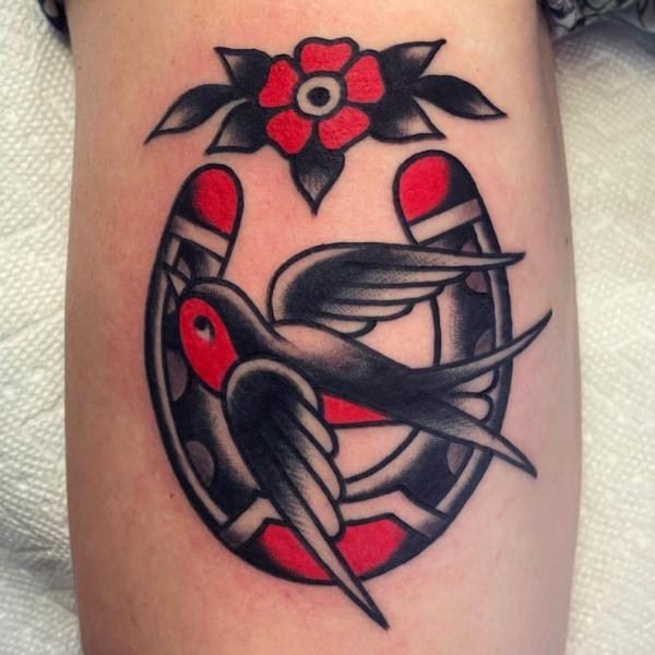 American traditional horseshoe and swallow tattoo