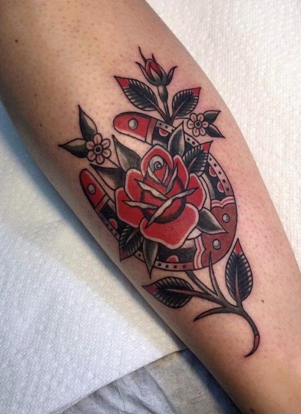 American traditional horseshoe with rose tattoo