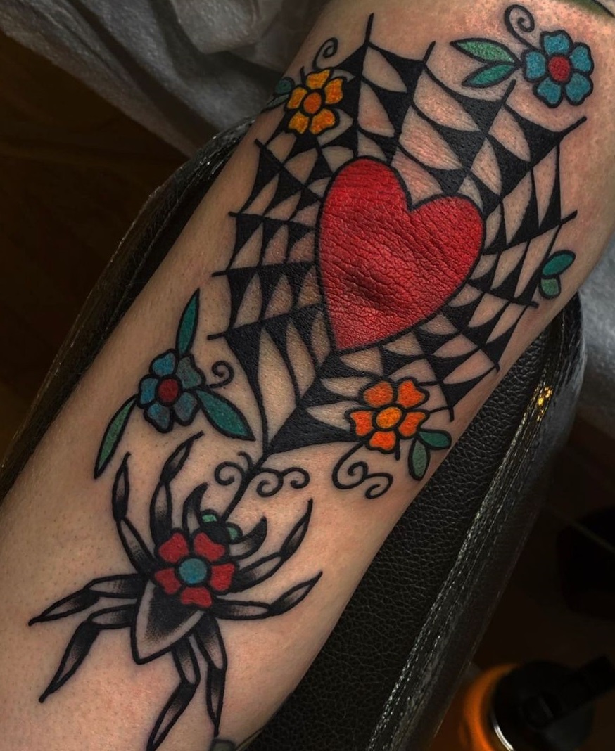 American traditional spiderweb with heart and spider elbow tattoo