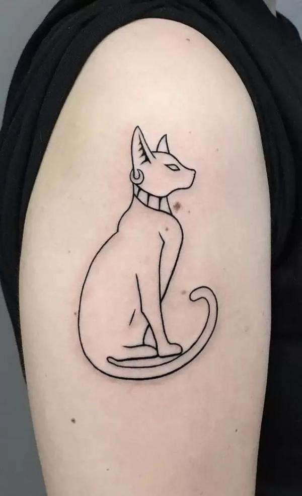Bastet outline tattoo on upper arm