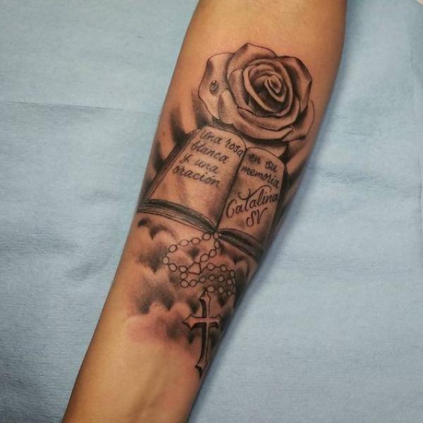 Bible with rose and rosary tattoo