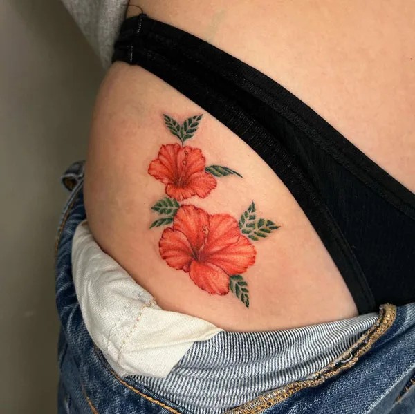 Bikini line hibiscus tattoo