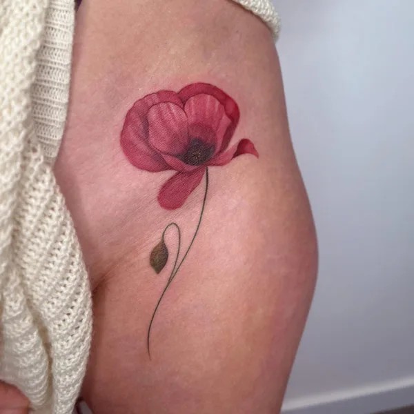Bikini line poppy tattoo