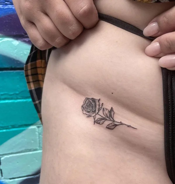 Bikini line rose tattoo black and white