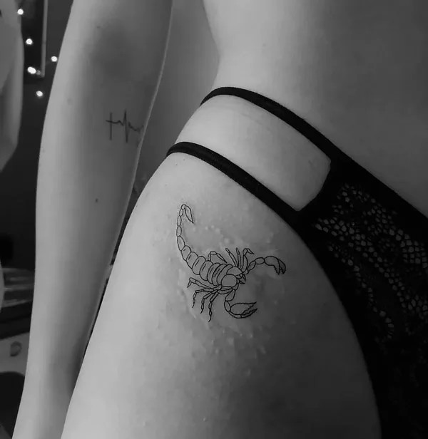 Bikini line scorpion outline tattoo