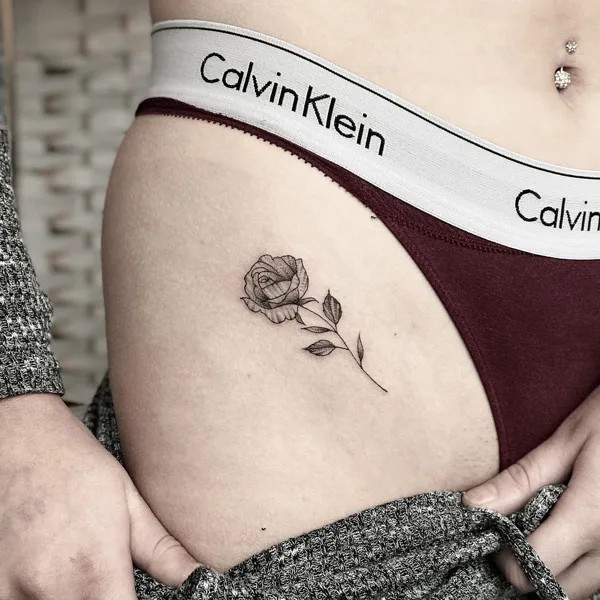 Bikini line small rose tattoo
