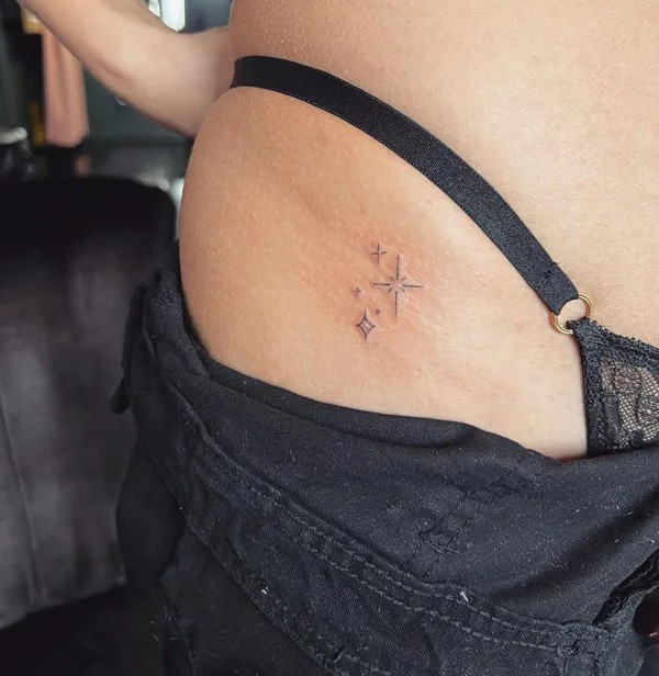 Bikini line stars tattoo