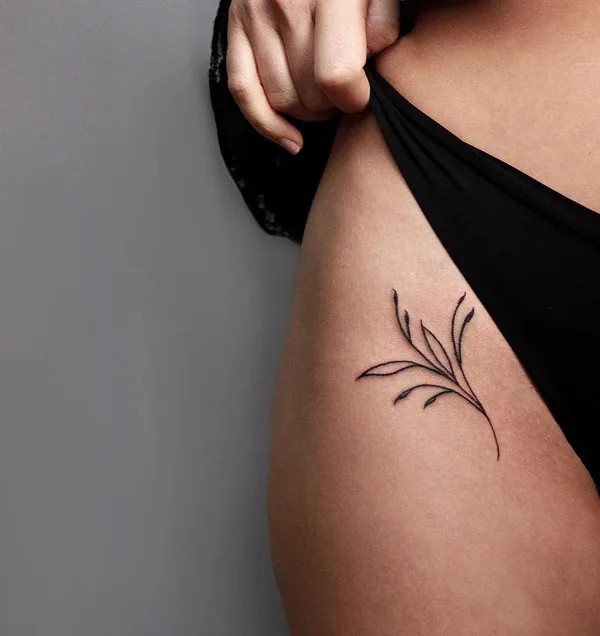 Bikini line vine tattoo