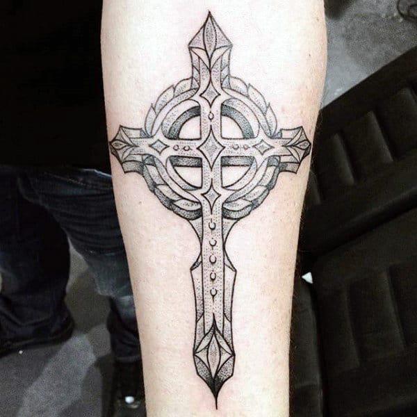 Black and grey Celtic cross tattoo forearm