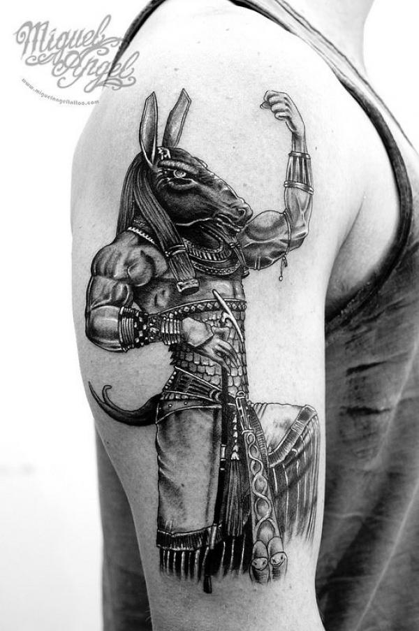 Black and grey Egyptian god seth tattoo