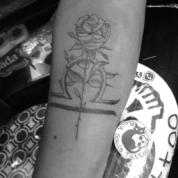 Black and grey Libra and rose tattoo