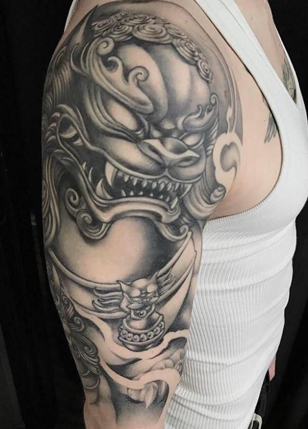 Black and grey foo dog half sleeve tattoo
