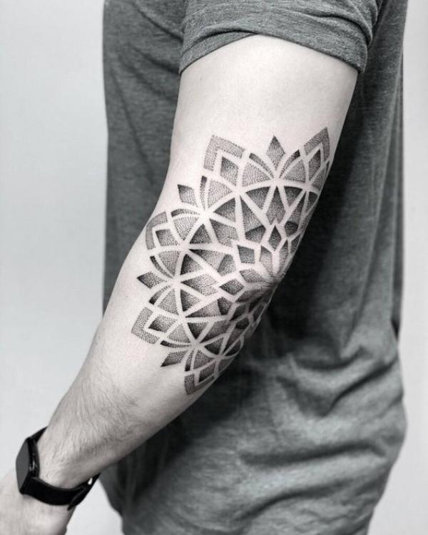 Black and grey mandala elbow tattoo