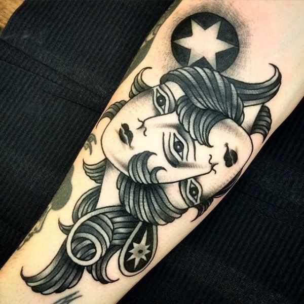 Black and white Gemini twin with star tattoo